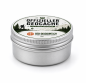 Preview: Geocaching Dose von Geo-Discount als Versteck unter einem Baumstamm im Wald.